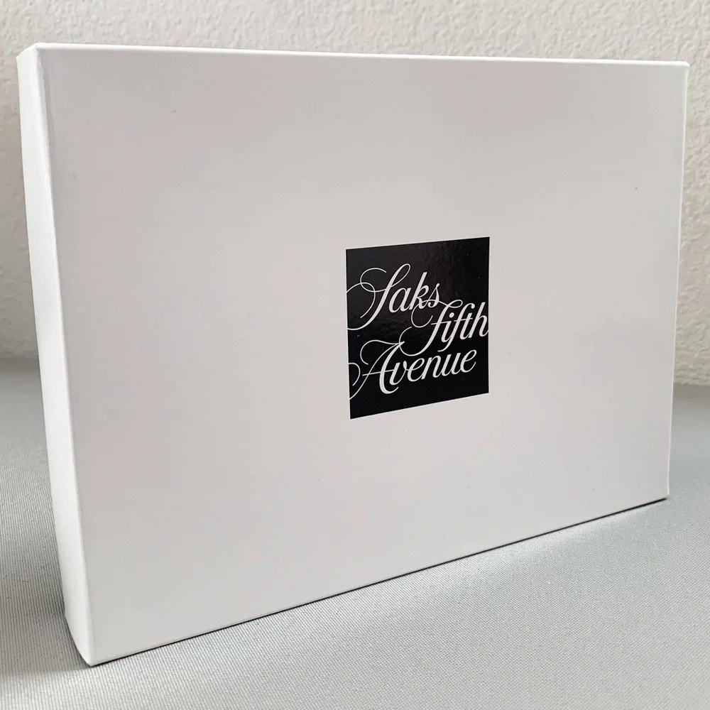 Hold Saks Fifth Avenue gift boxes